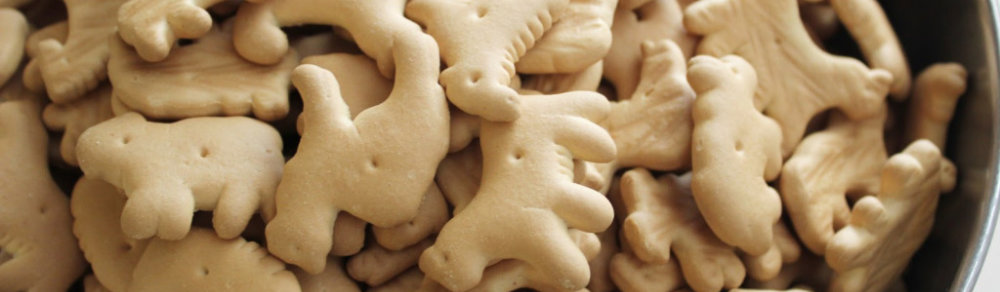 A brown bowl filled with animal crackers